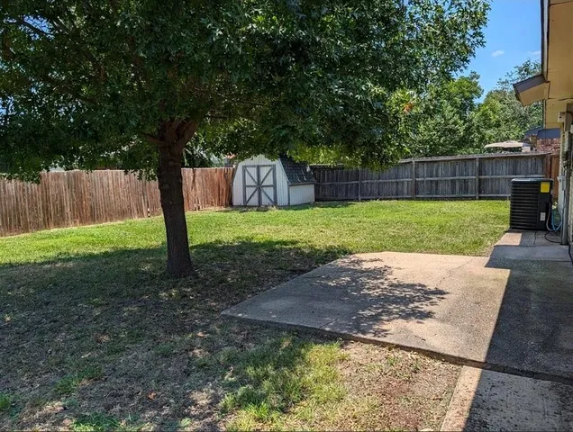 a backyard of a house with lots of green space