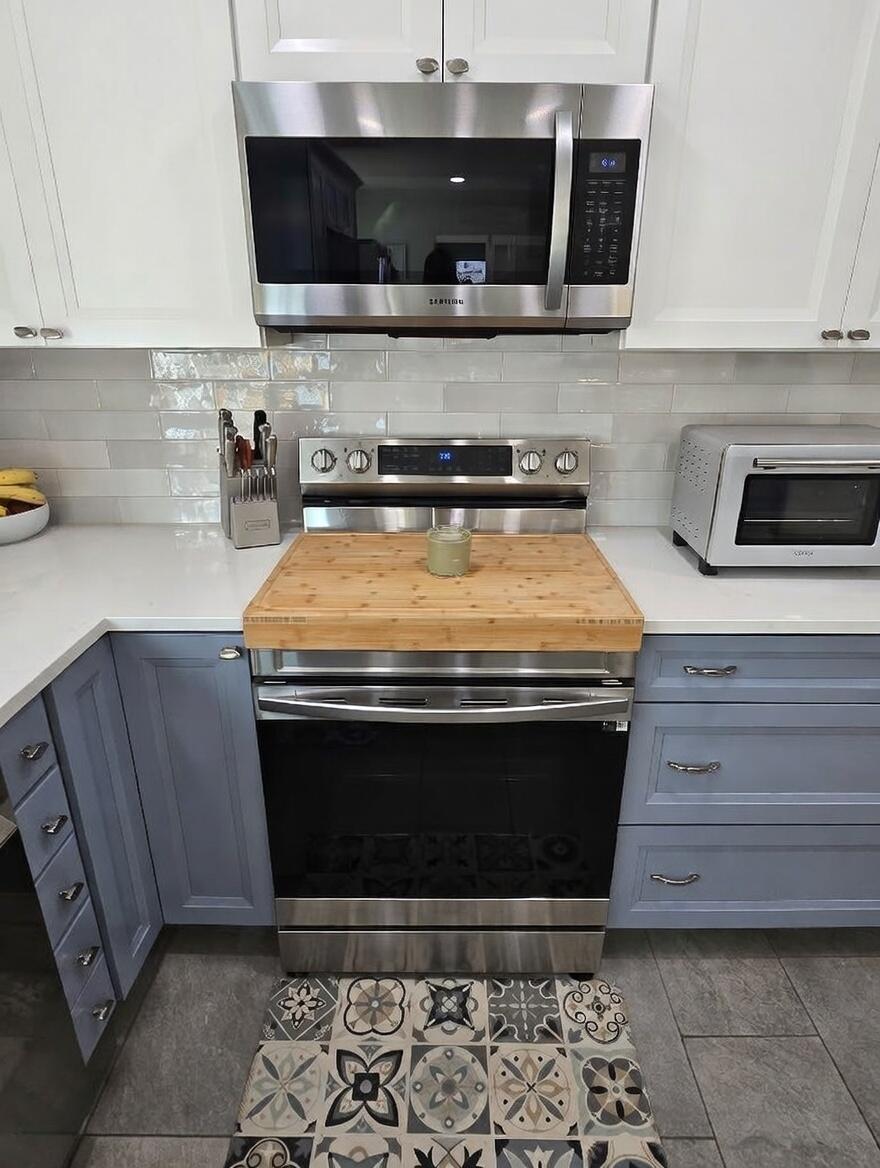 3315 27th Street Lubbock, TX 79410 - Photo 11 of 32 a stove top oven sitting inside of a kitchen