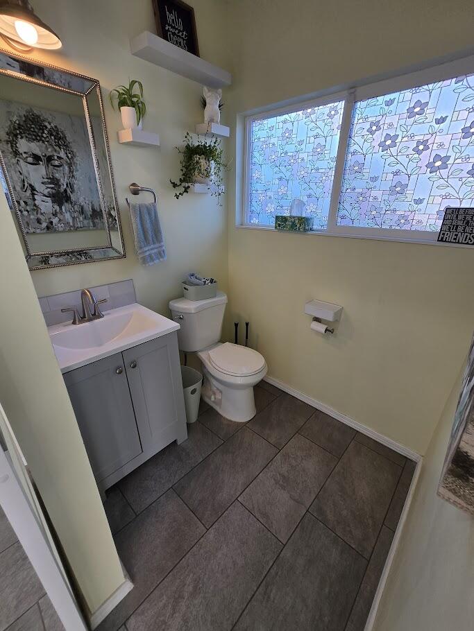 3315 27th Street Lubbock, TX 79410 - Photo 19 of 32 a bathroom with a sink a toilet and a shower