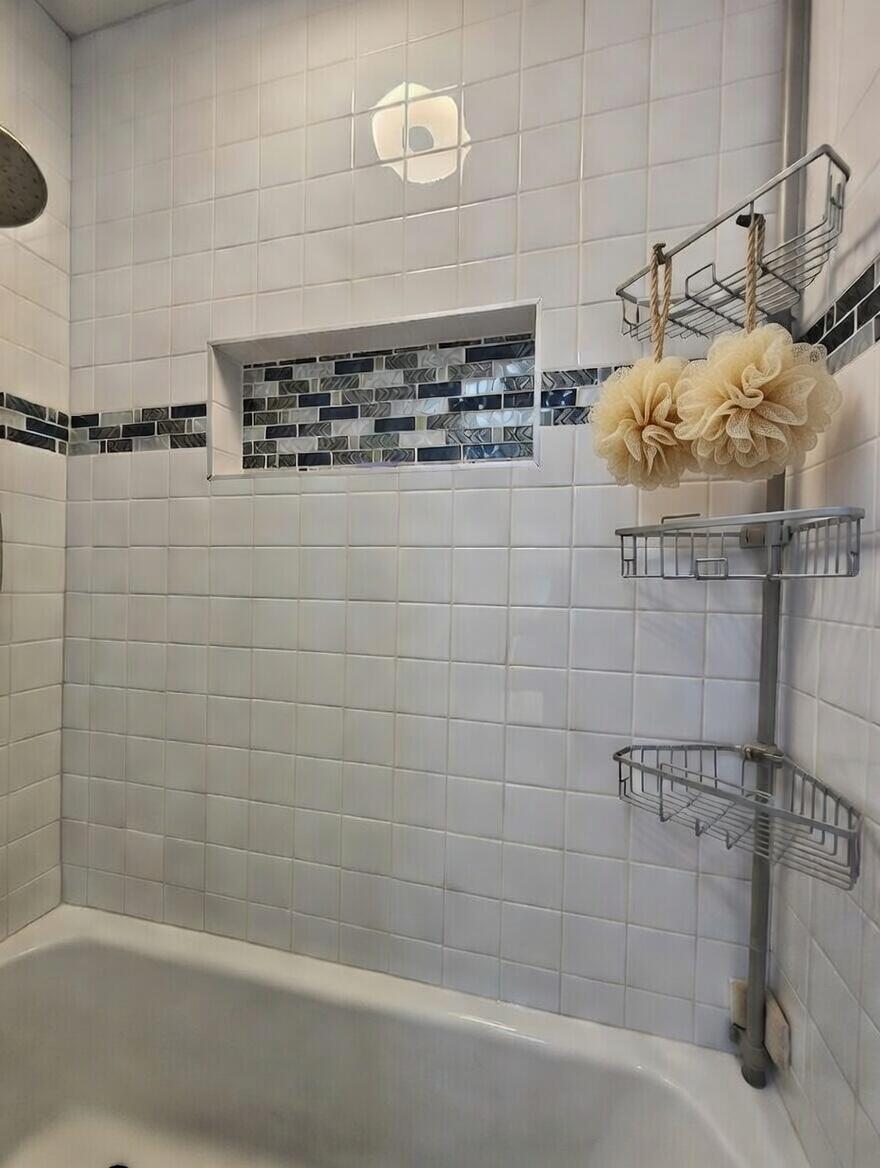 3315 27th Street Lubbock, TX 79410 - Photo 27 of 32 a bathroom with a shower