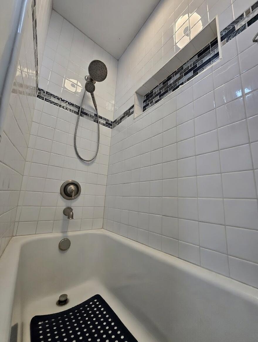 3315 27th Street Lubbock, TX 79410 - Photo 28 of 32 a bathroom with a shower