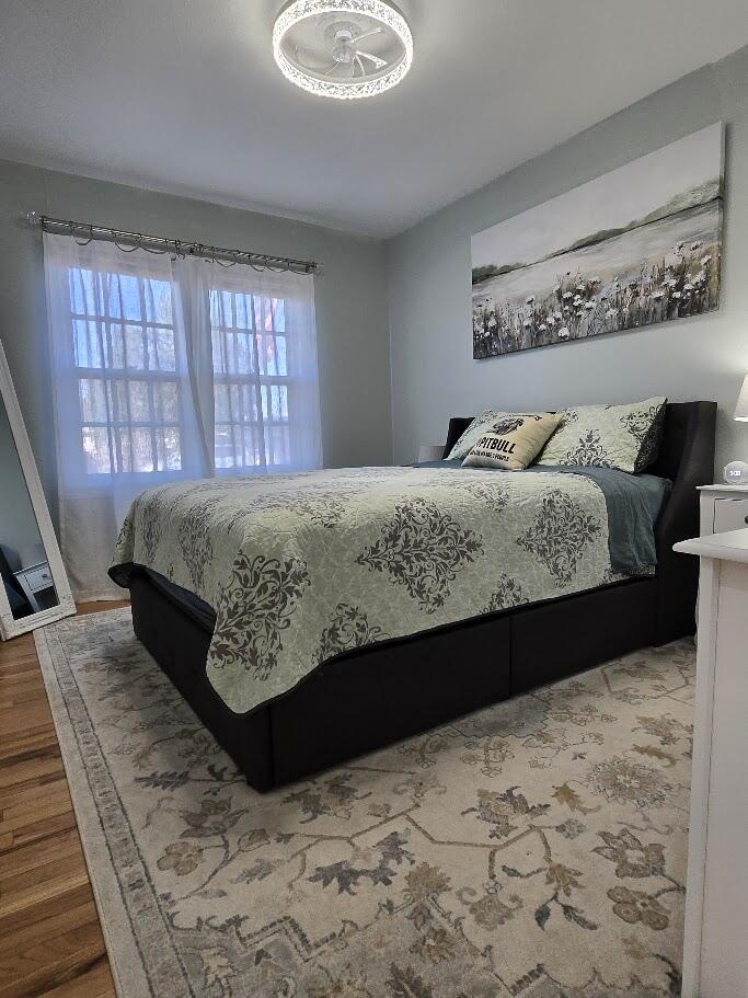 3315 27th Street Lubbock, TX 79410 - Photo 29 of 32 a bed sitting in a bedroom next to a window