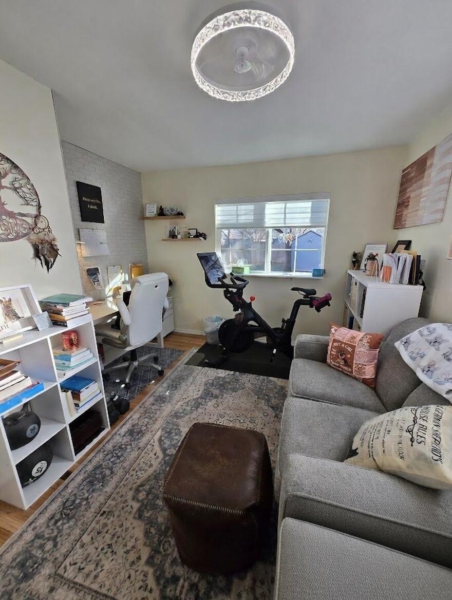 3315 27th Street Lubbock, TX 79410 - Photo 30 of 32 a living room with furniture and a window