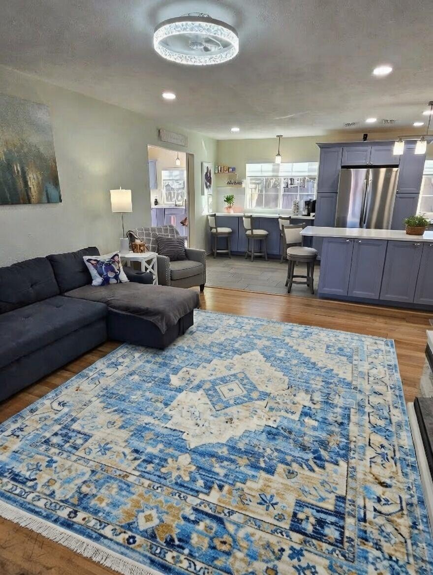 3315 27th Street Lubbock, TX 79410 - Photo 6 of 32 a living room with furniture and a rug