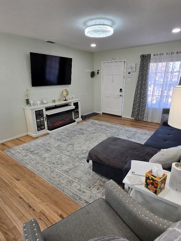 3315 27th Street Lubbock, TX 79410 - Photo 7 of 32 a living room with furniture and a flat screen tv