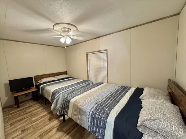 a reading room with furniture a flat screen tv and a stove