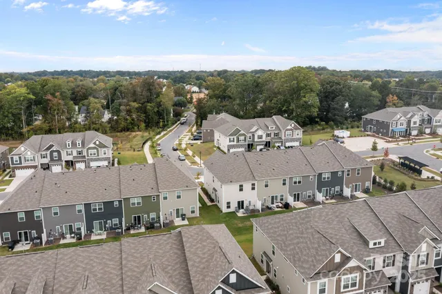 a view of a town with mountains in the background