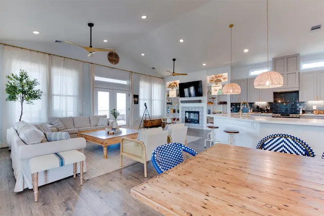 a dining room filled with furniture and wooden floor