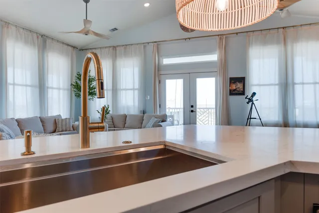 a view of a hallway with a mirror and furniture