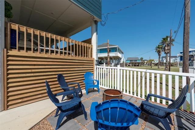a view of outdoor space with wooden floor and windows