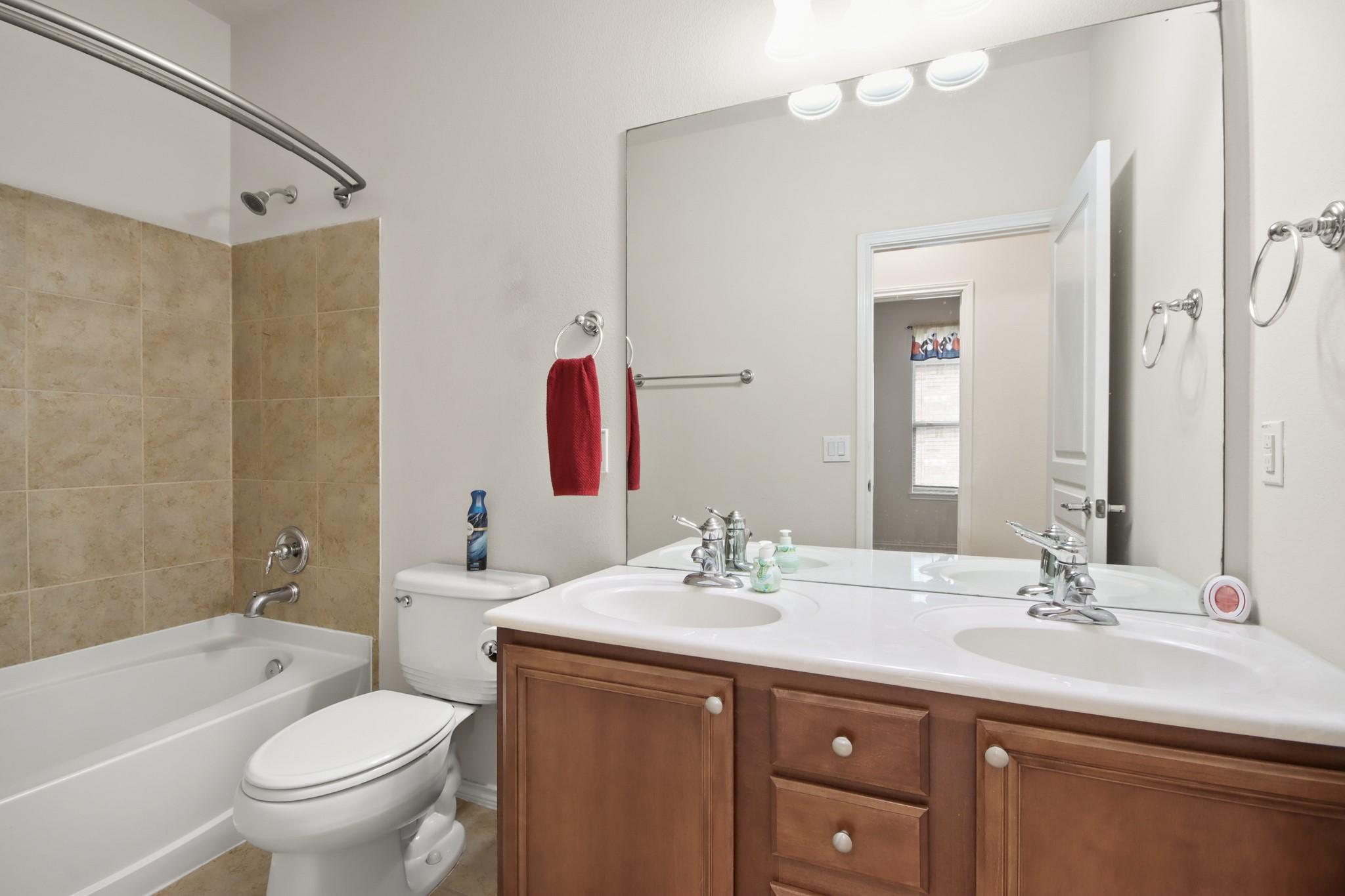 16918 Cherokee Lake Lane Houston, TX 77044 - Photo 15 of 35 a bathroom with a sink a toilet and shower