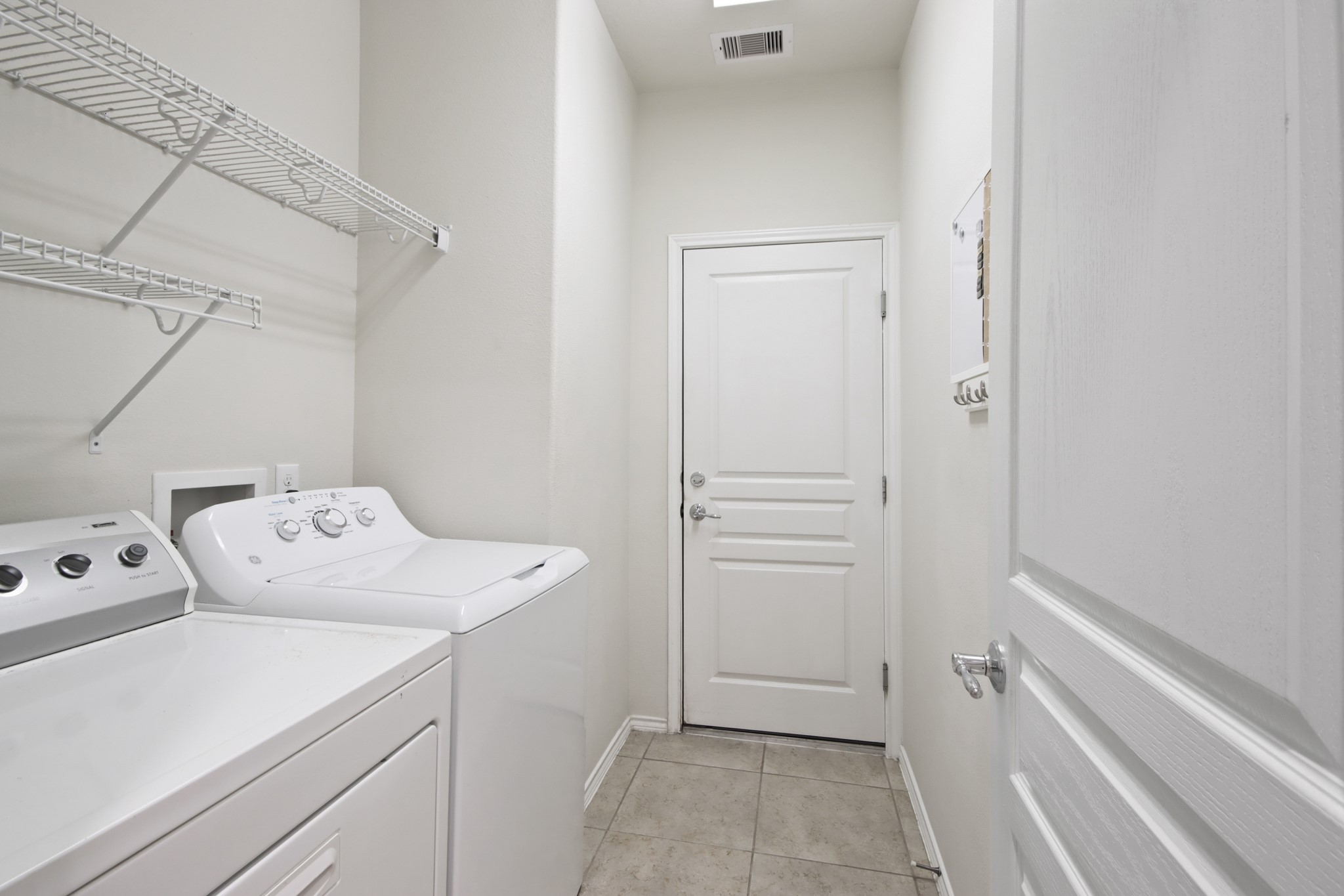 16918 Cherokee Lake Lane Houston, TX 77044 - Photo 25 of 35 a utility room with dryer and washer