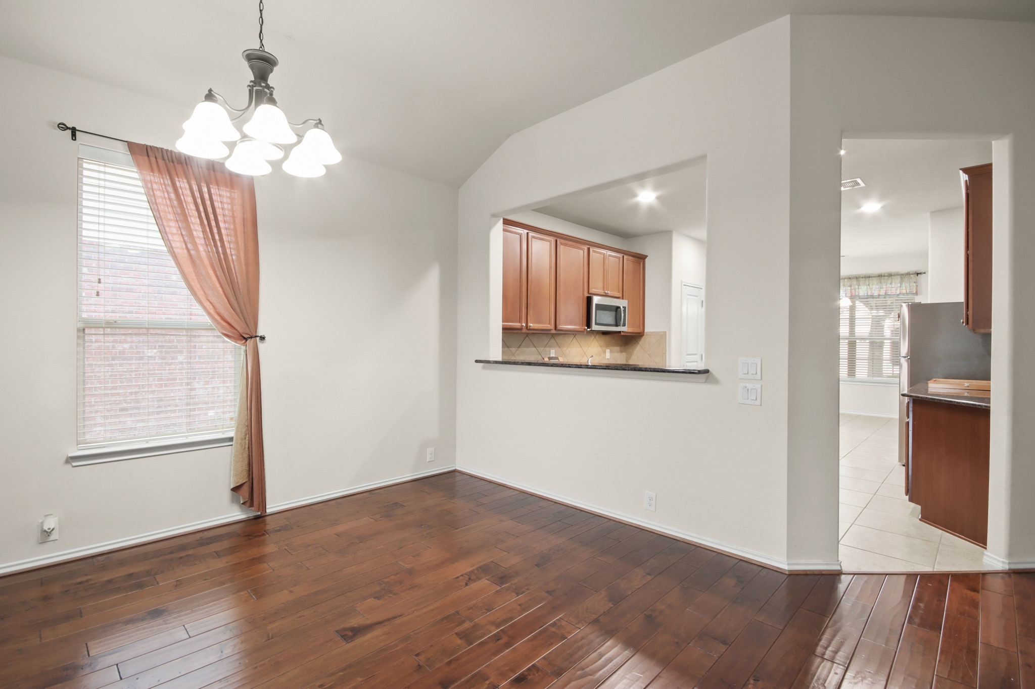 16918 Cherokee Lake Lane Houston, TX 77044 - Photo 3 of 35 a view of livingroom with window and wooden floor