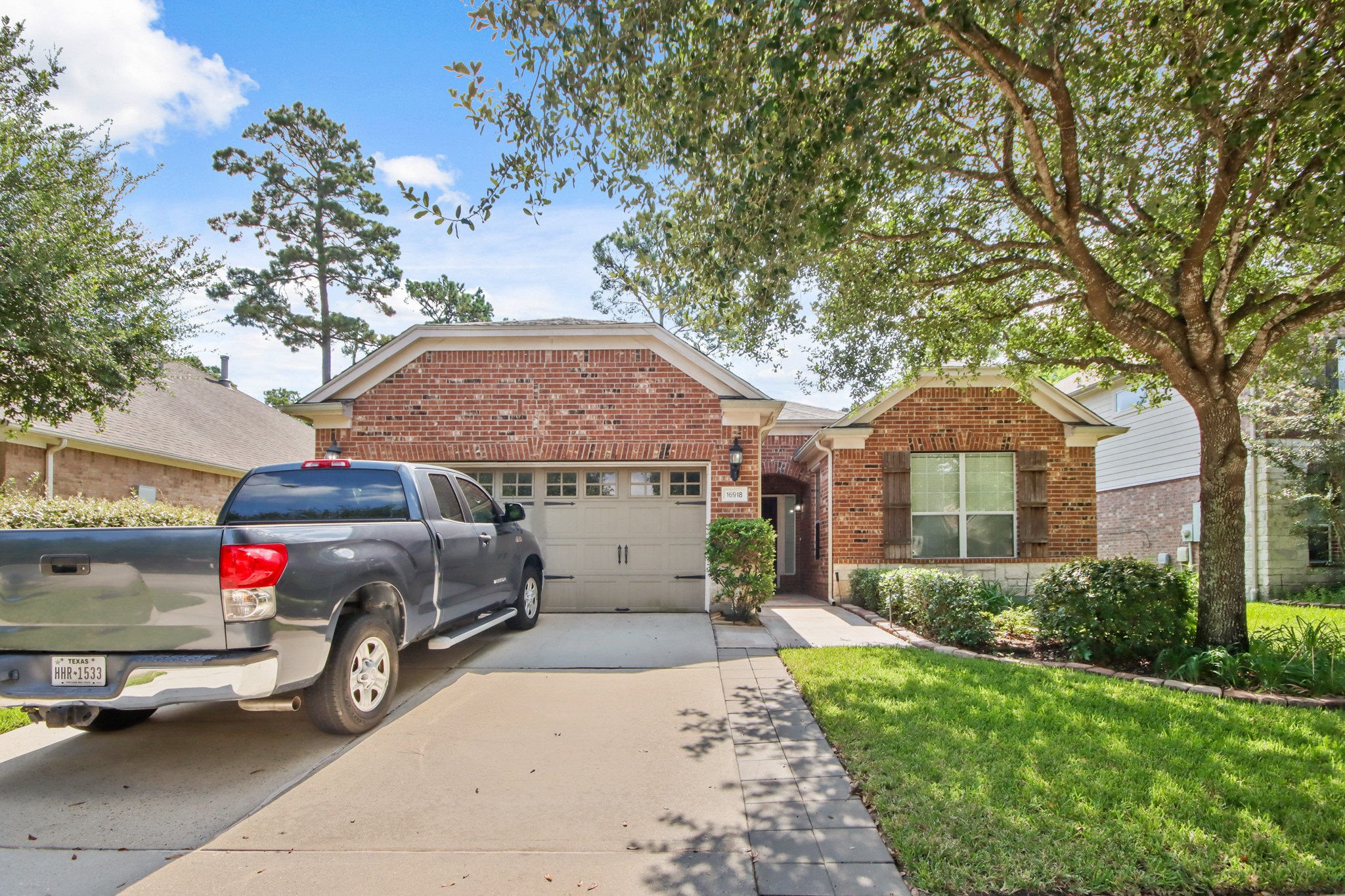 16918 Cherokee Lake Lane Houston, TX 77044 - Photo 35 of 35 a car parked in front of a house