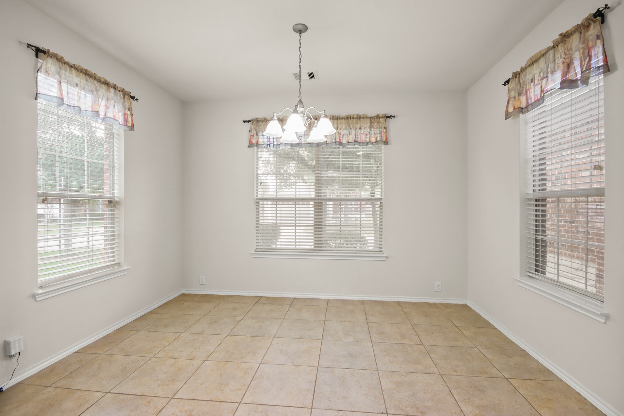 16918 Cherokee Lake Lane Houston, TX 77044 - Photo 9 of 35 a view of an empty room with a window