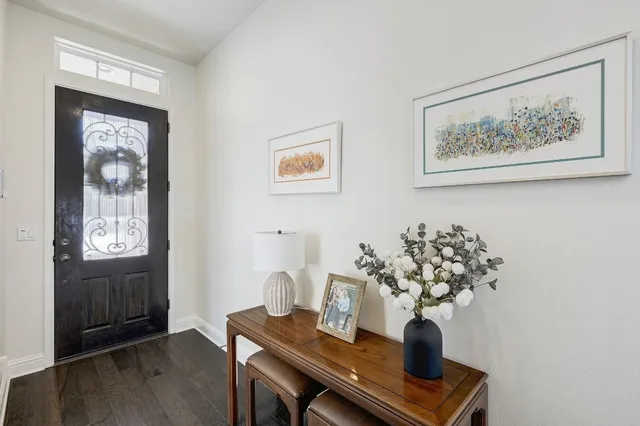 a view of a workspace with furniture and wooden floor