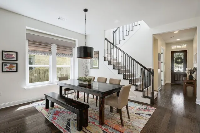 a view of a livingroom with furniture window and wooden floor