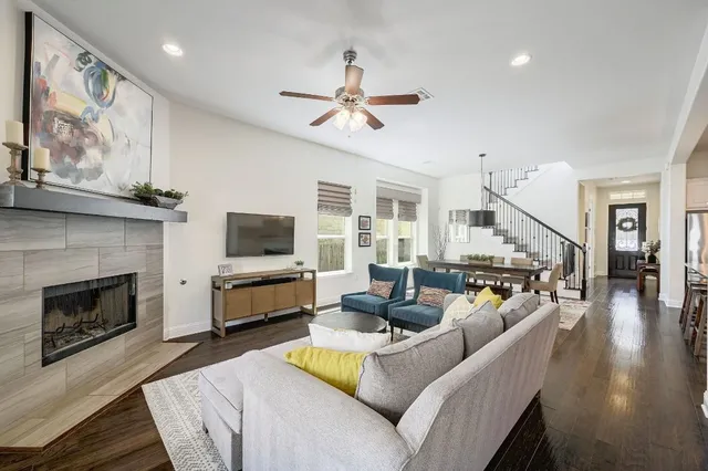 a living room with furniture and a fireplace