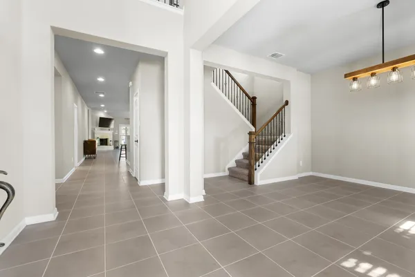 a view of a hallway view with staircase