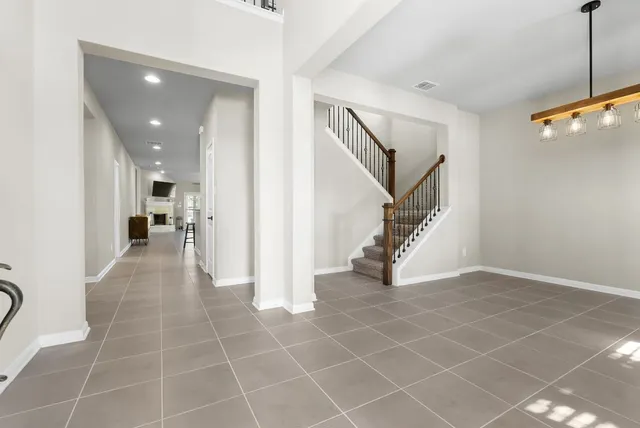 a view of a hallway view with staircase
