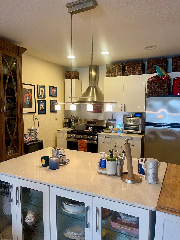 406 East Monroe Street, Unit A Austin, TX 78704 - Photo 13 of 35 a kitchen with kitchen island a stove a sink and a refrigerator