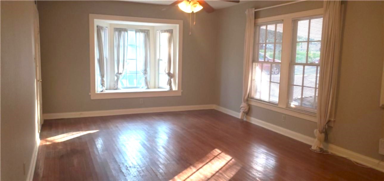 406 East Monroe Street, Unit A Austin, TX 78704 - Photo 17 of 35 a view of an empty room with wooden floor and a window