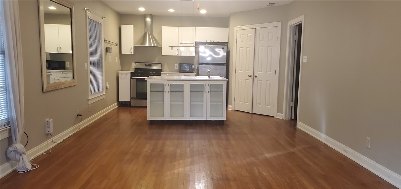 406 East Monroe Street, Unit A Austin, TX 78704 - Photo 19 of 35 a kitchen with stainless steel appliances a refrigerator and a stove top oven