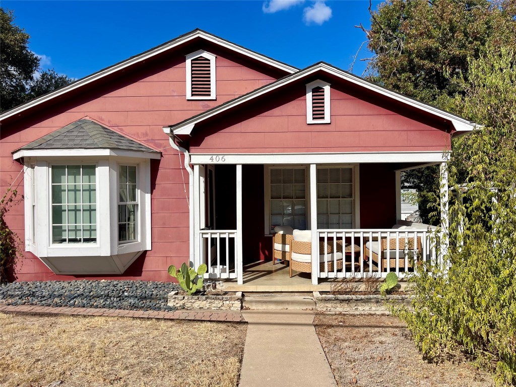 a front view of a house with a porch