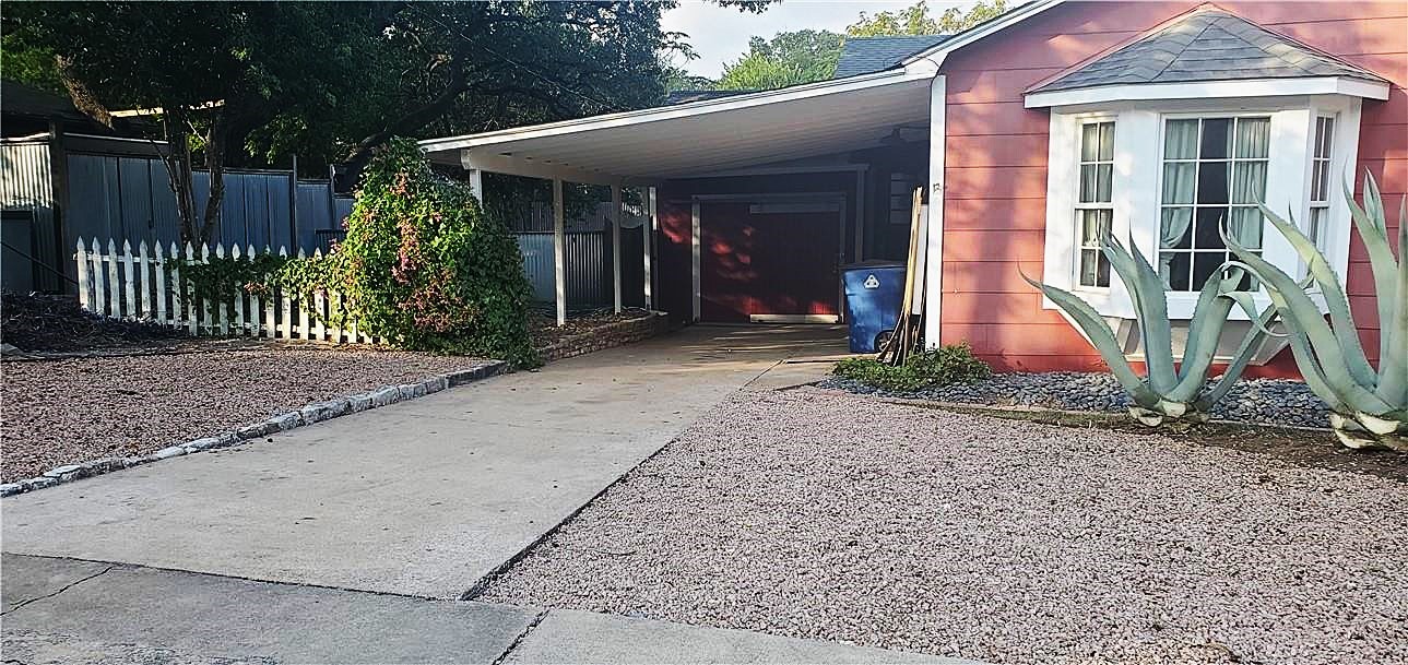 406 East Monroe Street, Unit A Austin, TX 78704 - Photo 4 of 35 a front view of a house with a porch