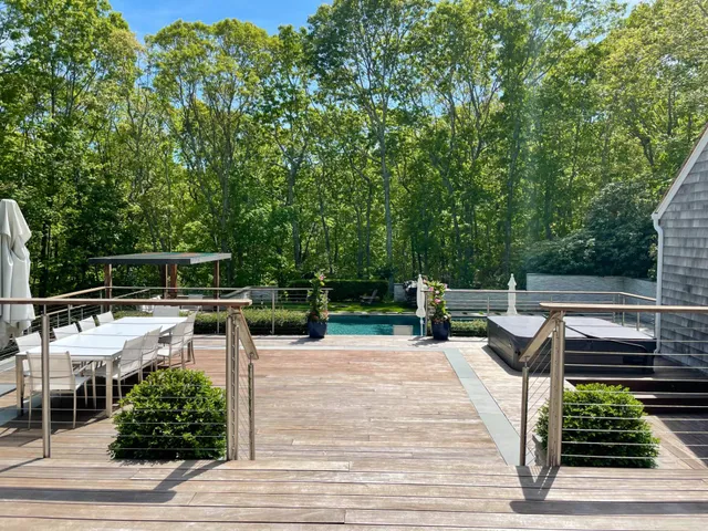 a view of backyard with sitting area