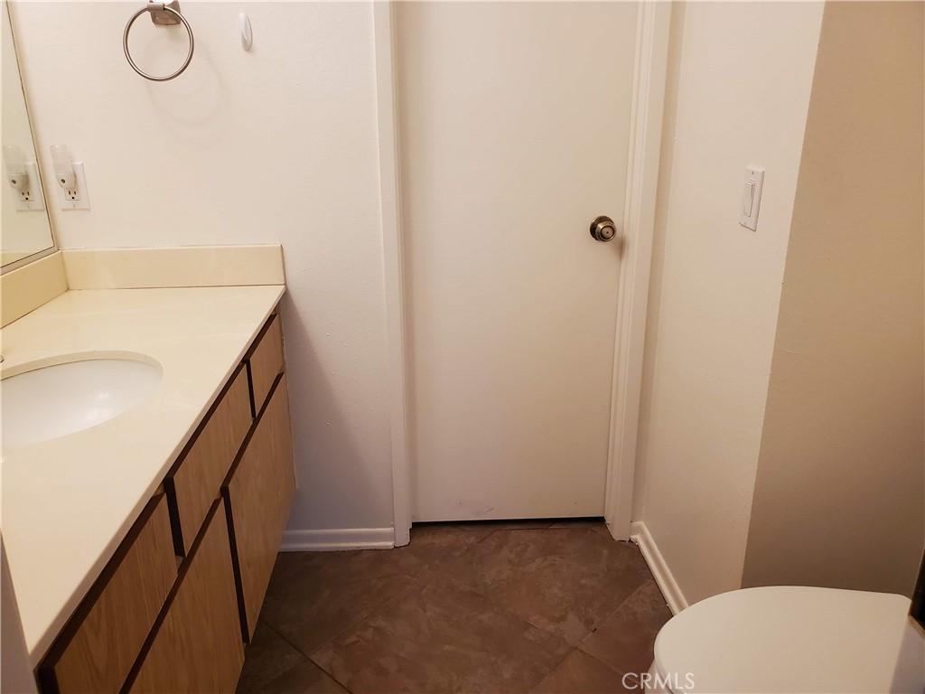 7864 Portola Road Rancho Cucamonga, CA 91730 - Photo 14 of 37 a bathroom with a toilet and a sink
