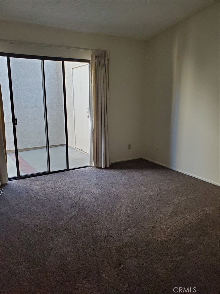 7864 Portola Road Rancho Cucamonga, CA 91730 - Photo 15 of 37 a view of empty room with window