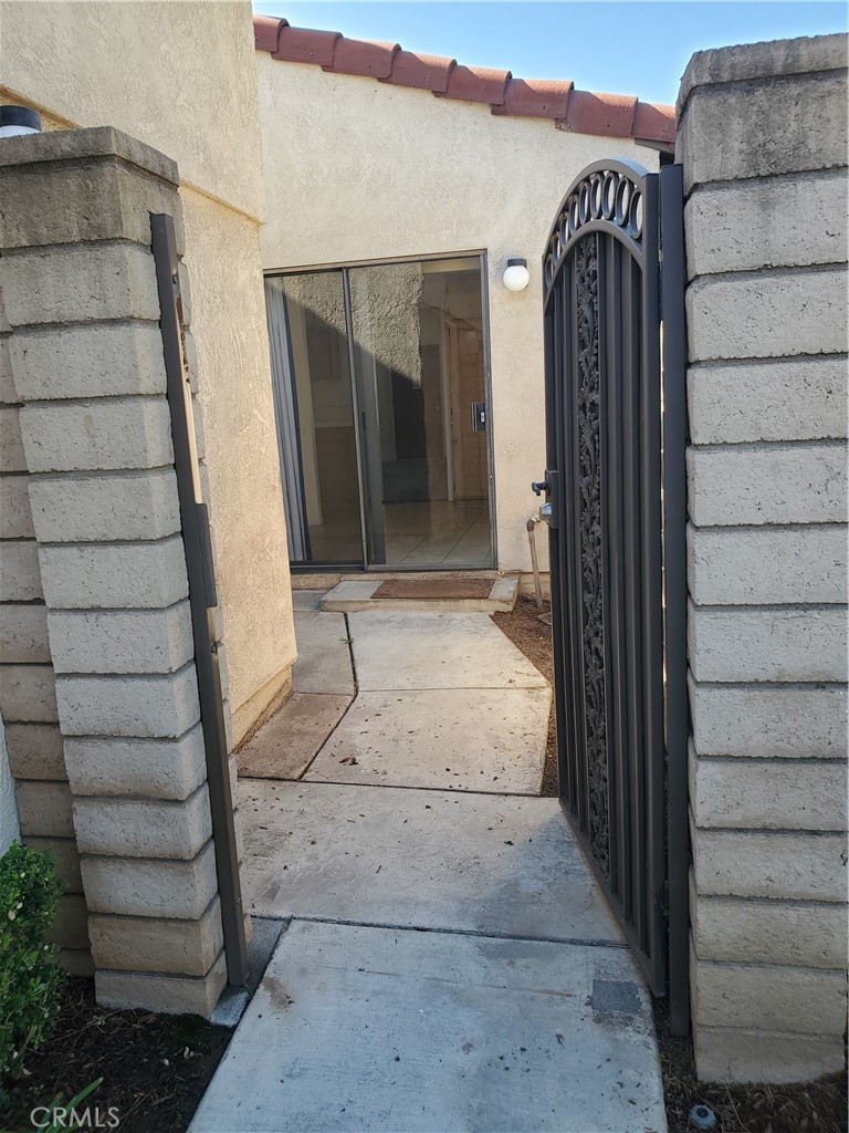 7864 Portola Road Rancho Cucamonga, CA 91730 - Photo 23 of 37 a view of entryway with a house