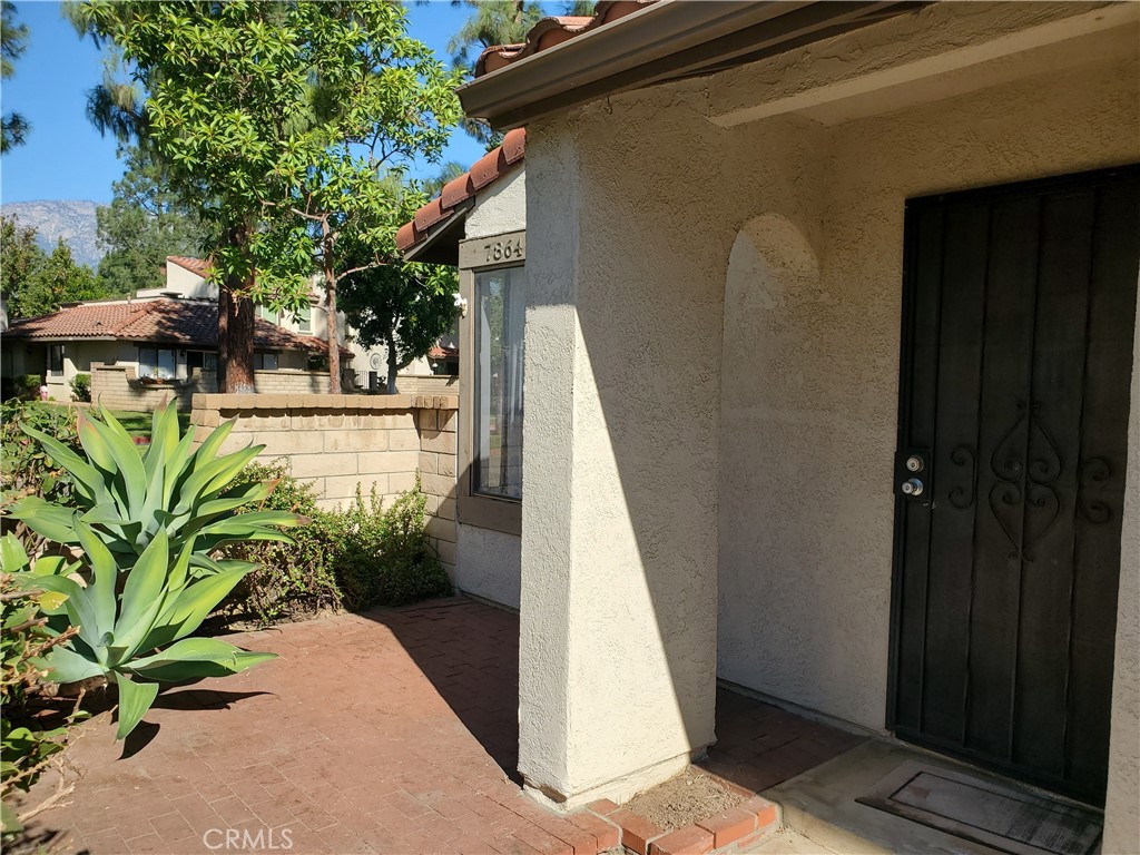 7864 Portola Road Rancho Cucamonga, CA 91730 - Photo 28 of 37 a view of a house with a backyard
