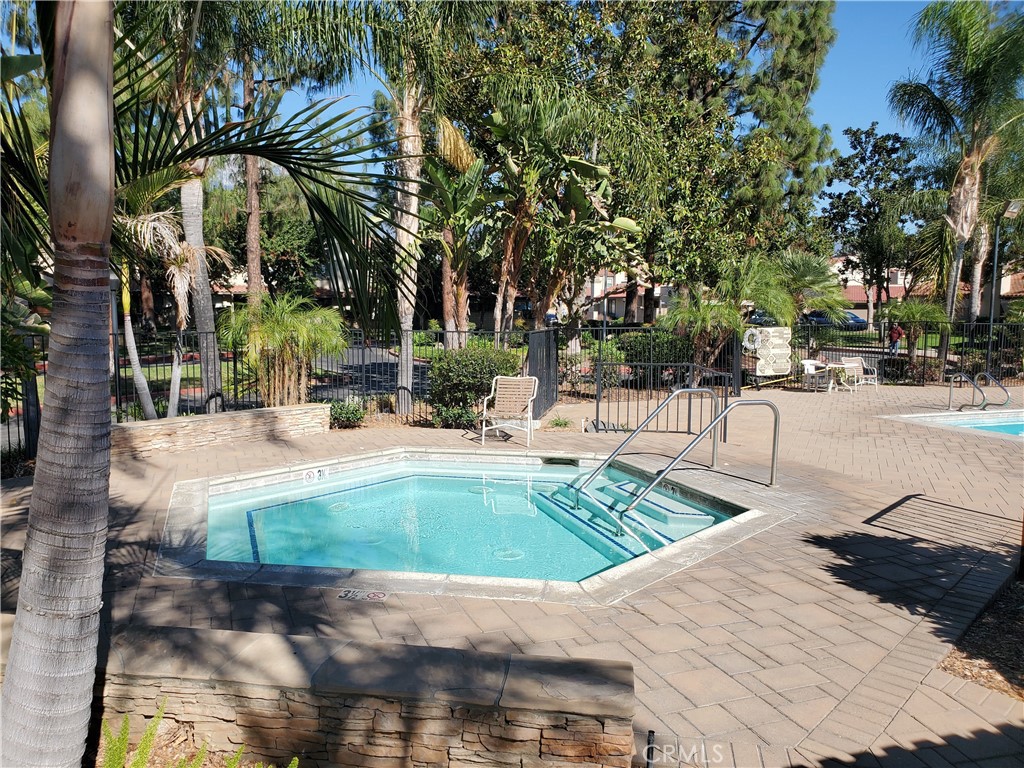 7864 Portola Road Rancho Cucamonga, CA 91730 - Photo 35 of 37 a view of a swimming pool with a patio