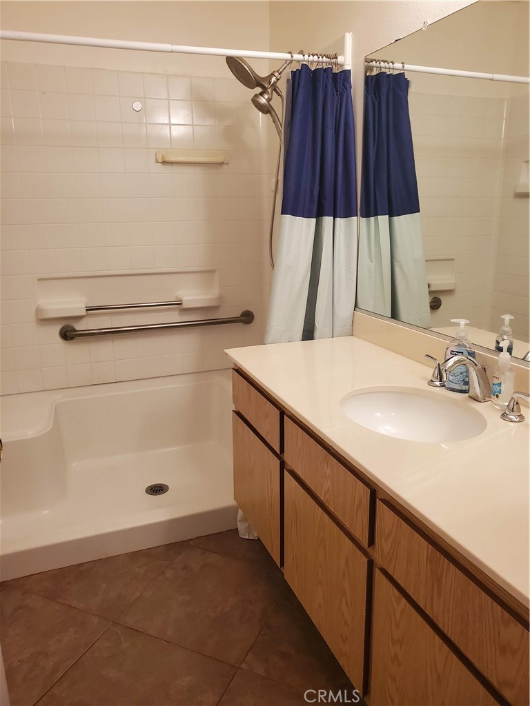 7864 Portola Road Rancho Cucamonga, CA 91730 - Photo 10 of 37 a bathroom with a sink and a shower