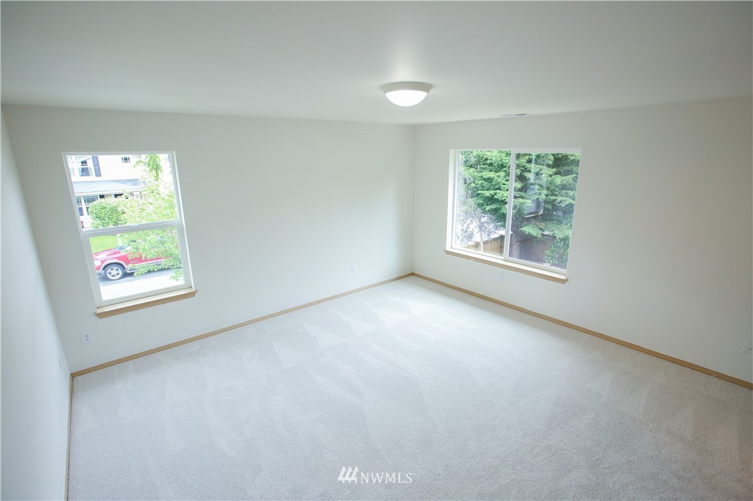 3501 154th Place Southeast Bothell, WA 98012 - Photo 14 of 20 an empty room with windows