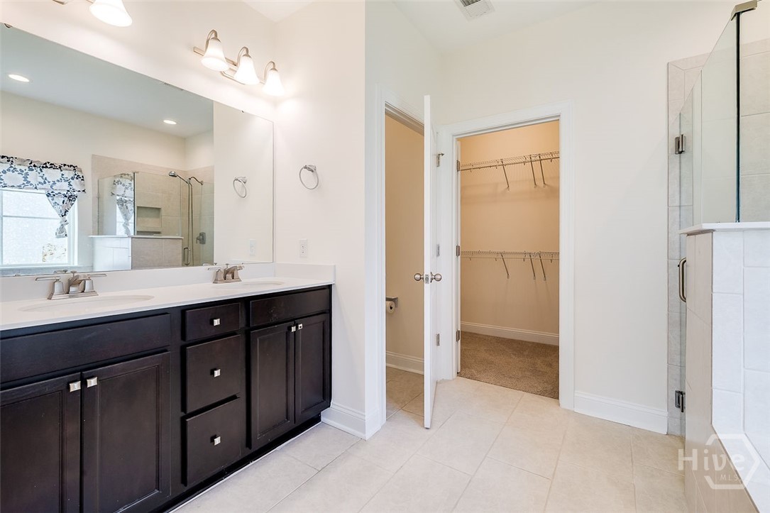 107 Merribee Lane Pooler, GA 31322 - Photo 29 of 46 Large double vanity and cabinet space along with tile floors.