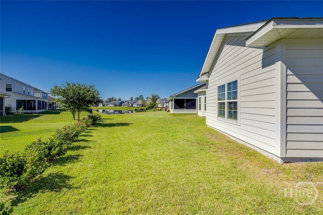 107 Merribee Lane Pooler, GA 31322 - Photo 40 of 46 Back yard with lagoon view, and the lagoon is also seen from the dining room and patio!