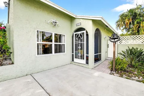 a view of front door and yard