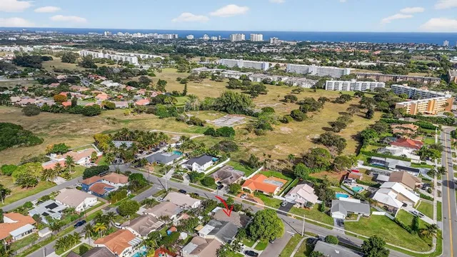 an aerial view of residential houses with city view