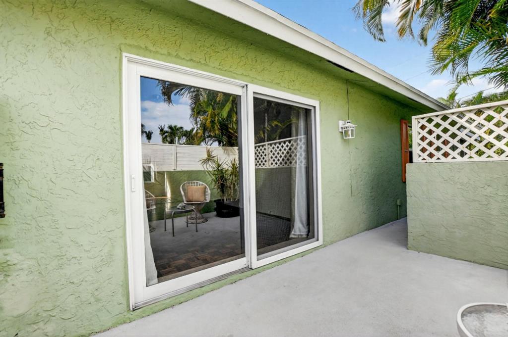 501 Northwest 54th Street Boca Raton, FL 33487 - Photo 37 of 43 a view of a glass door and a porch