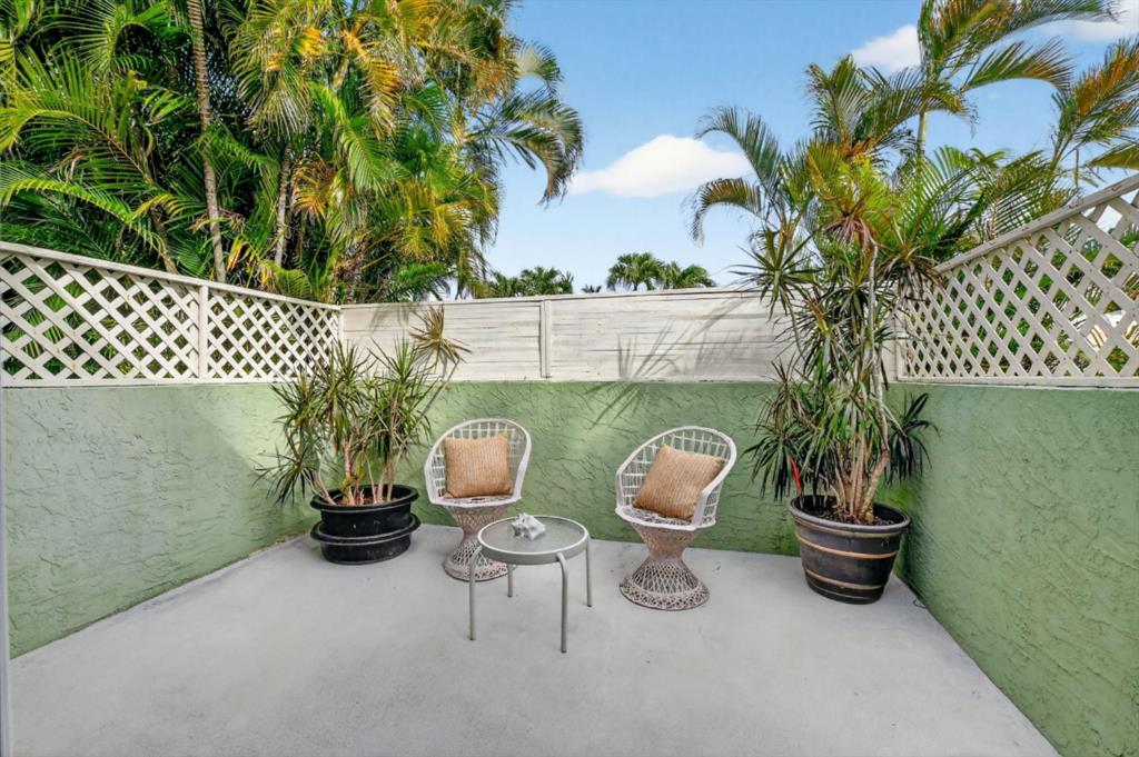 501 Northwest 54th Street Boca Raton, FL 33487 - Photo 4 of 43 a view of a chairs and table in the patio