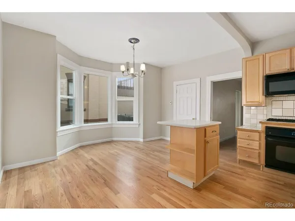 a view interior of a house livingroom and kitchen with wooden floor