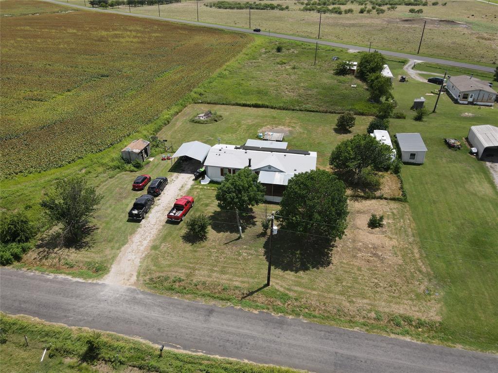 15962 Fritcher Road Pilot Point, TX 76258 - Photo 2 of 24 an aerial view of a house with a ocean view