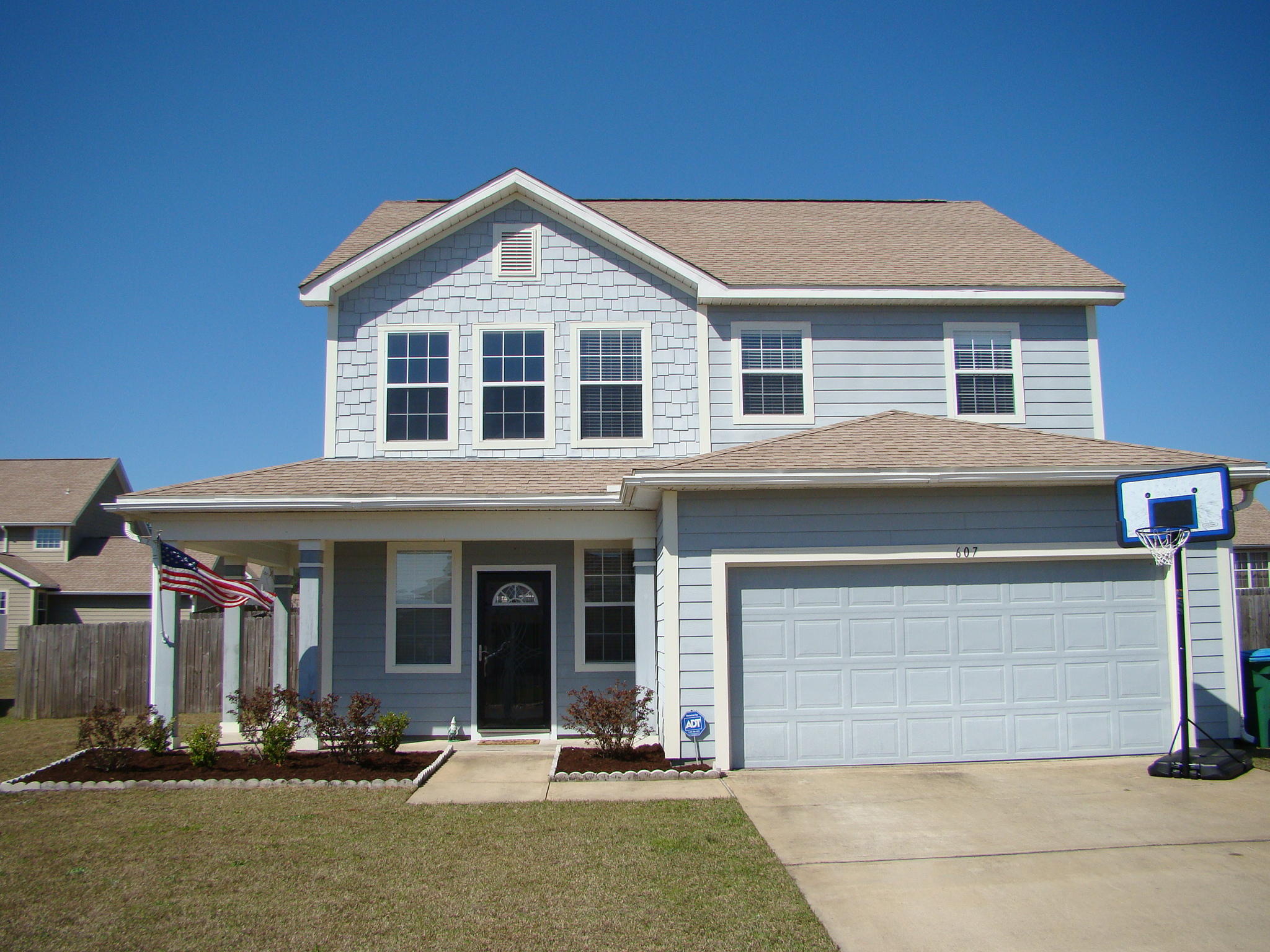 front view of a house with a patio