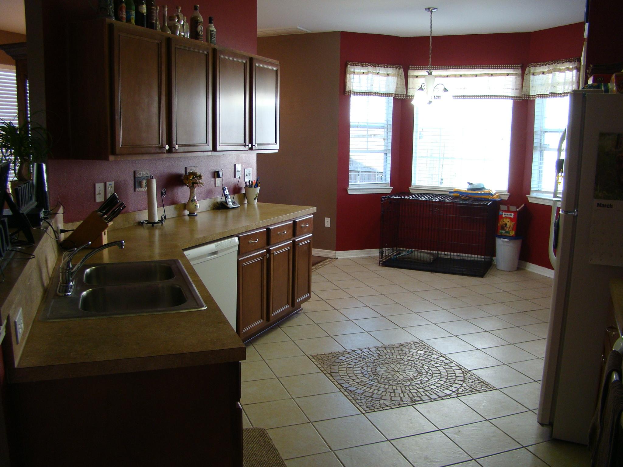 607 Prairie Street Crestview, FL 32536 - Photo 11 of 43 a kitchen with a sink and a stove next to a window