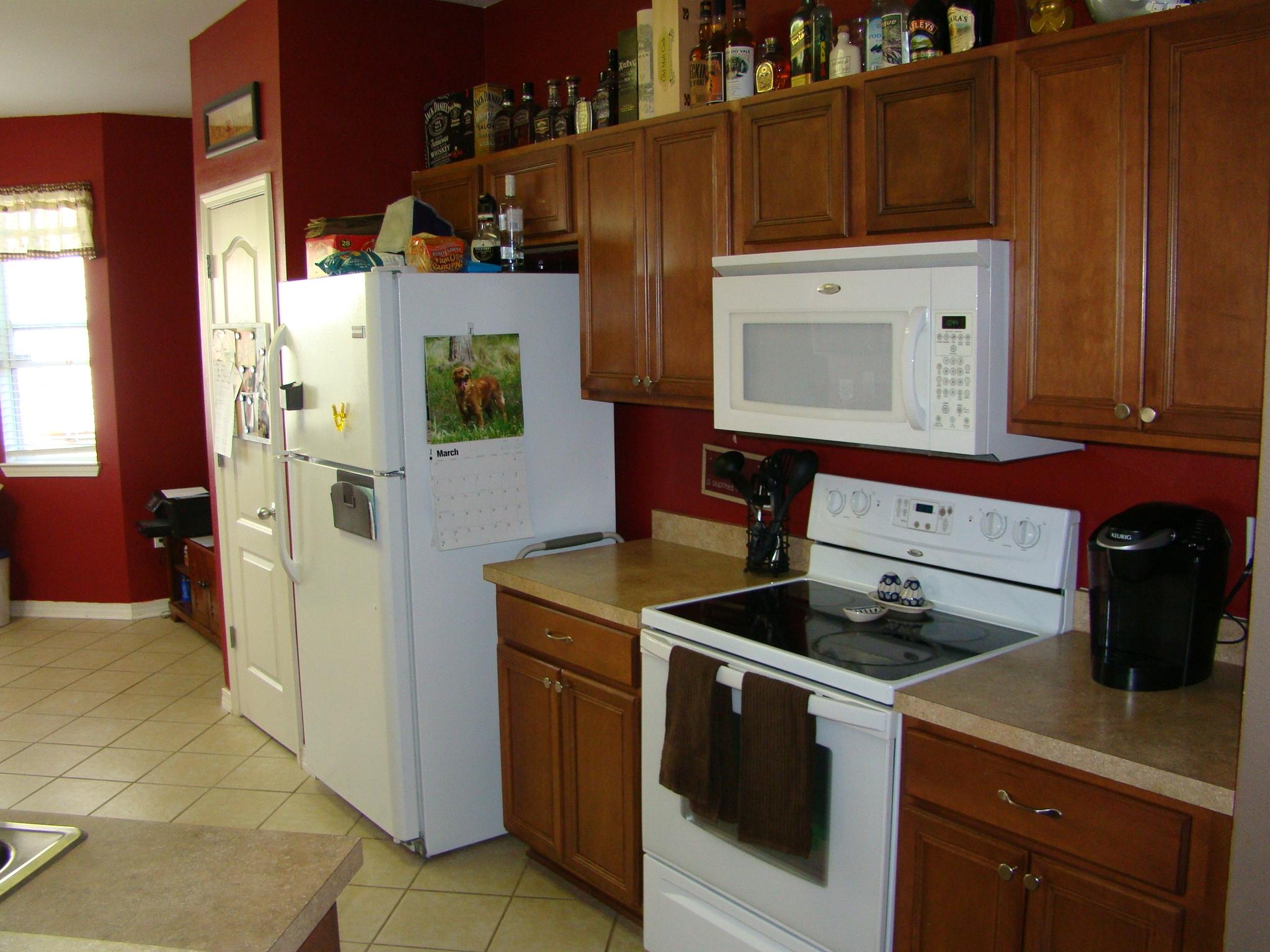 607 Prairie Street Crestview, FL 32536 - Photo 12 of 43 a kitchen with stainless steel appliances granite countertop a stove and a refrigerator