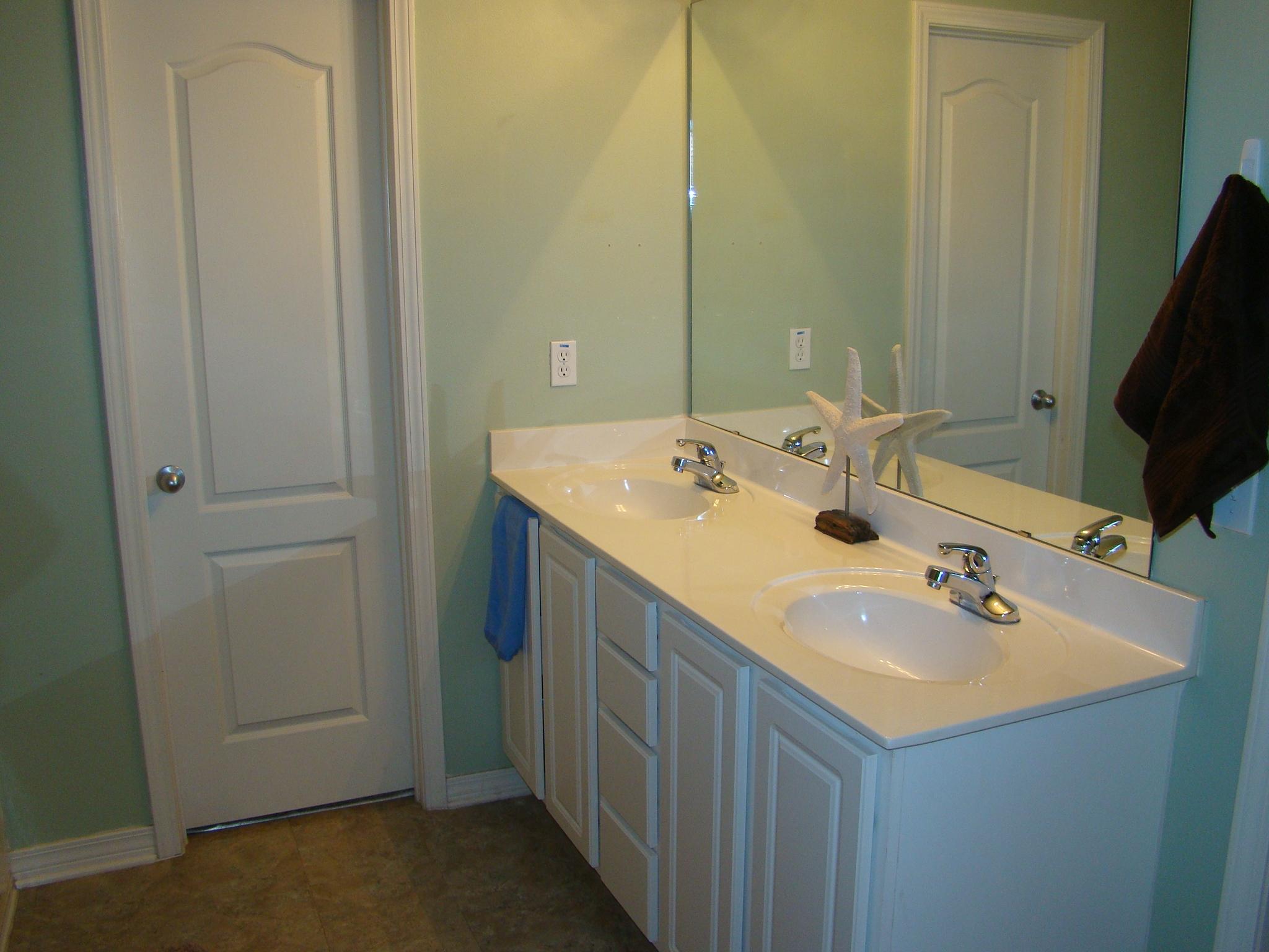 607 Prairie Street Crestview, FL 32536 - Photo 24 of 43 a bathroom with a sink and a mirror