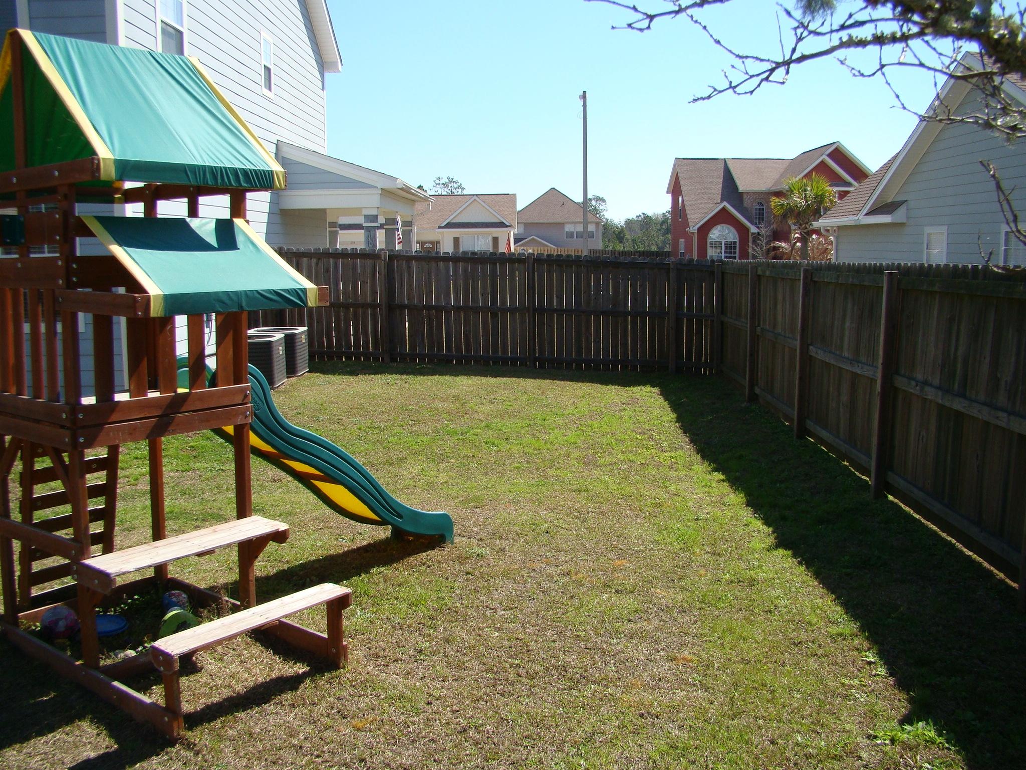 607 Prairie Street Crestview, FL 32536 - Photo 40 of 43 a view of a swimming pool with a lounge chair